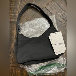 Brand new small handle bag